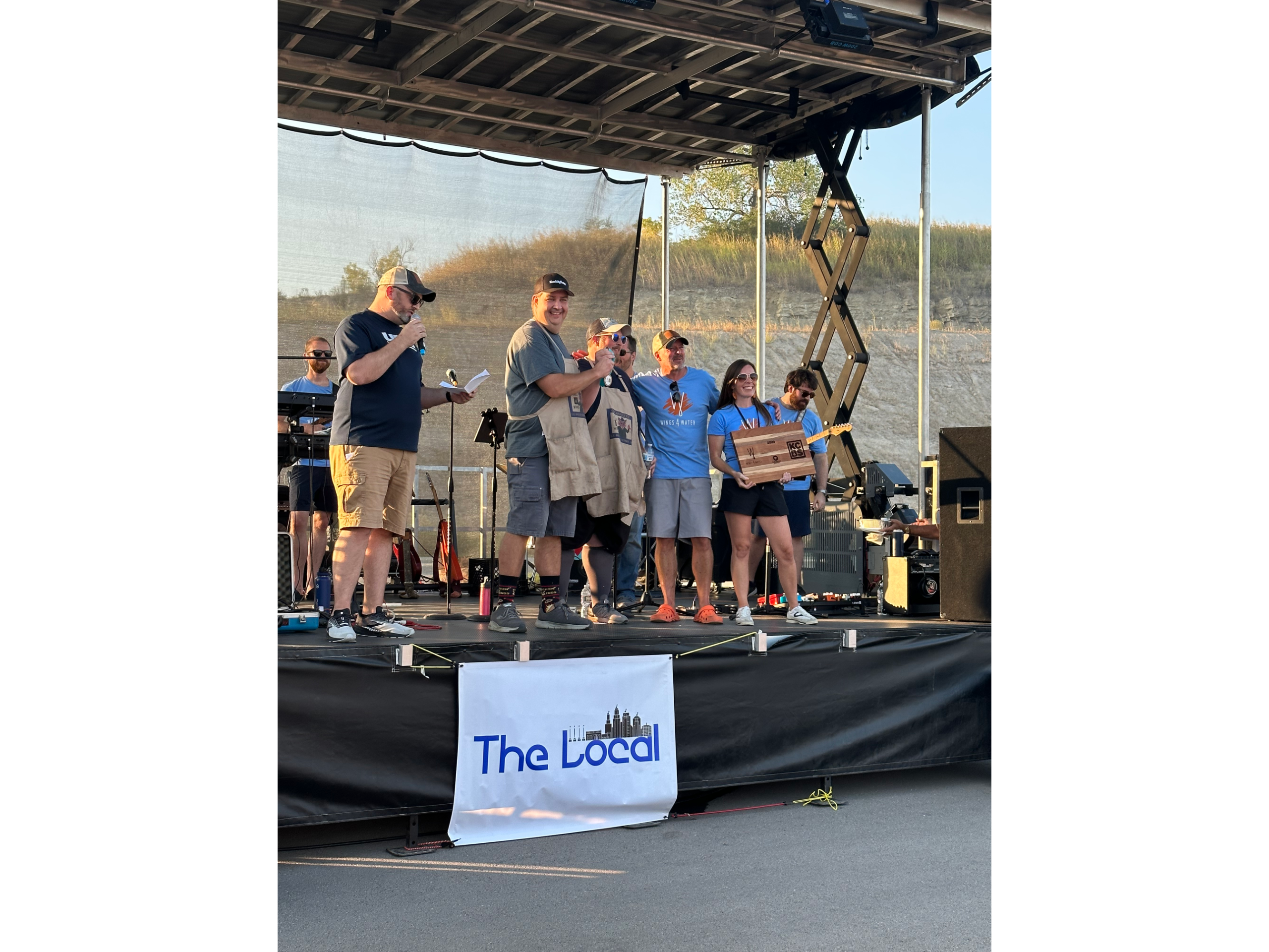 ERBBQ team receiving an award at Wings 4 Water.