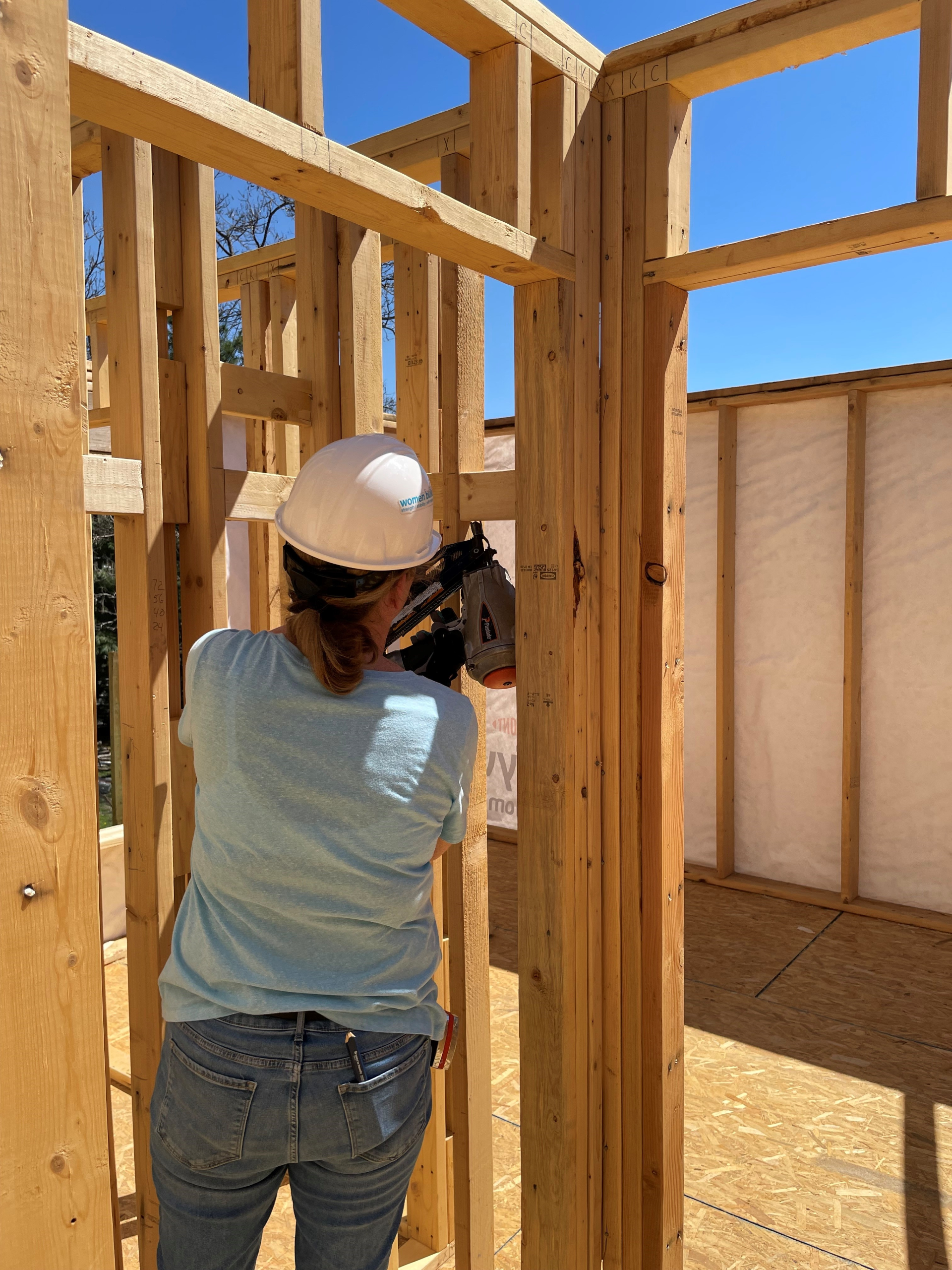 Jill helping to frame a Habitat for Humanity house.