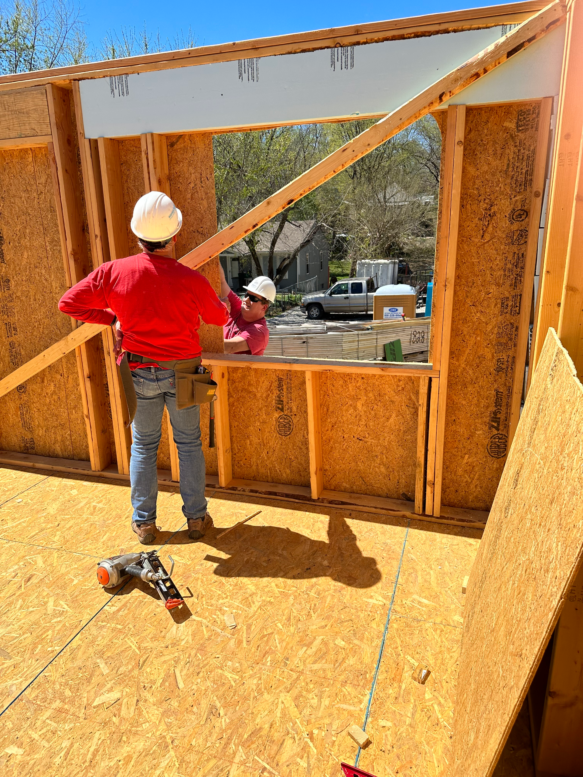 Kevin working on the front wall of a Habitat for Humanity house.