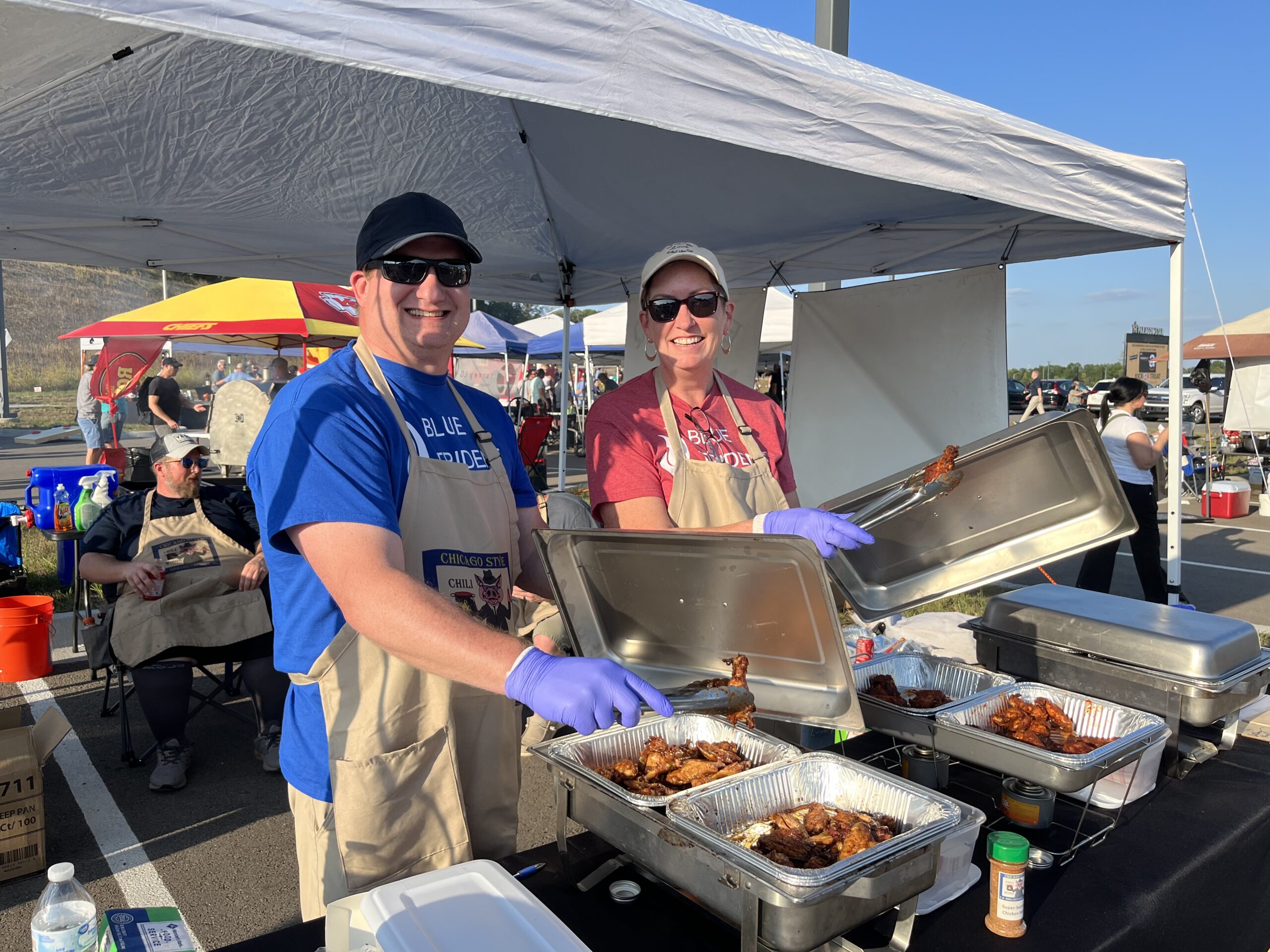 Kevin and Jill serving chicken wings at Wings 4 Water.