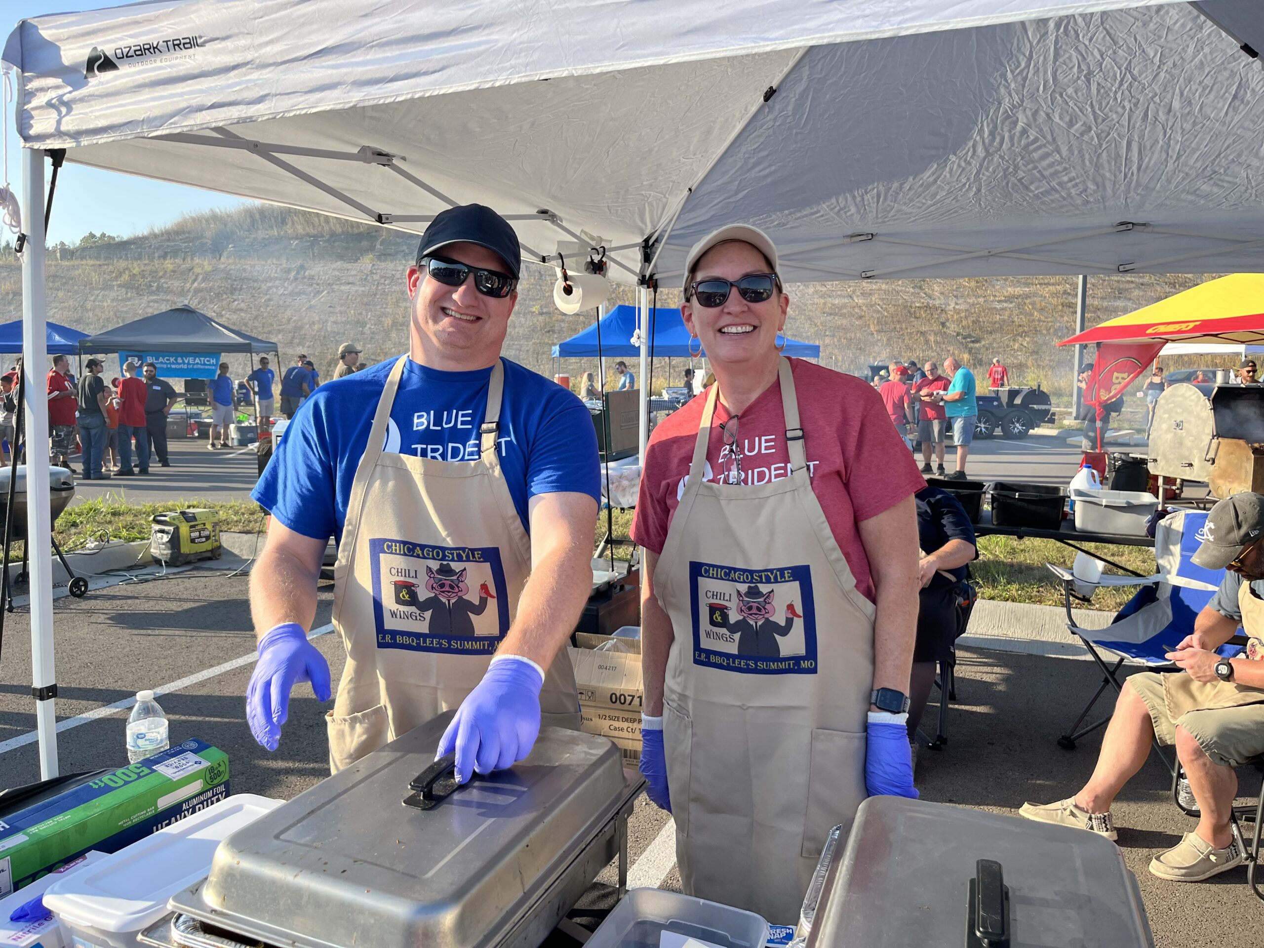 Kevin and Jill prepping to serve chicken wings at Wings 4 Water.