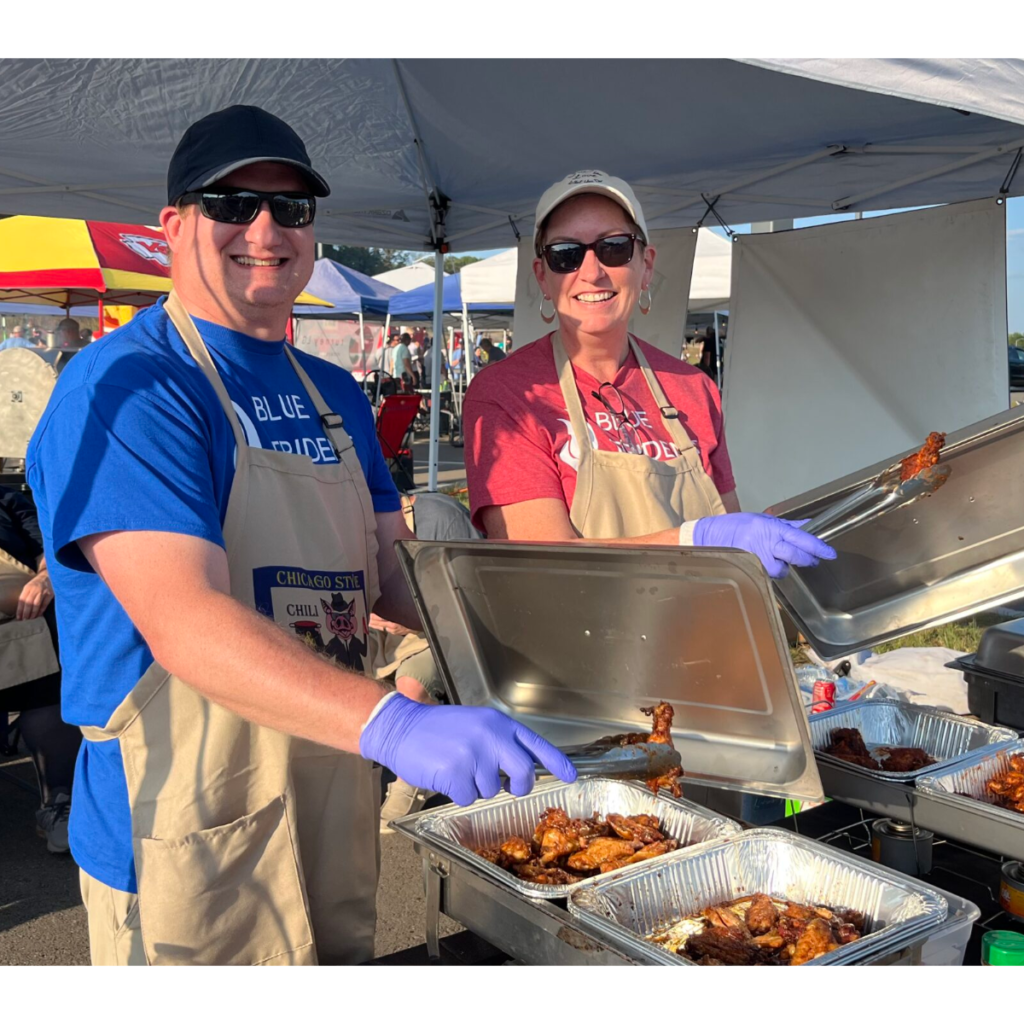 Kevin and Jill serving chicken wings at Wings 4 Water.